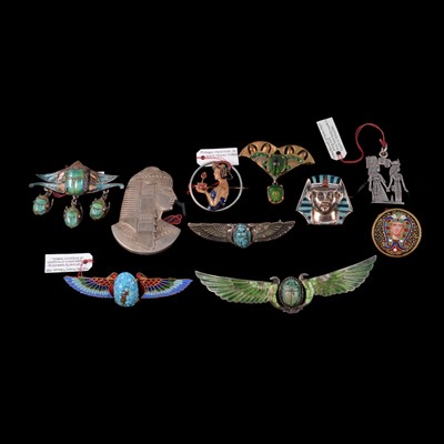 Lot 1214 - Fifteen vintage pseudo-Egyptian brooches and pins.