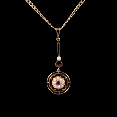 Lot 298 - A sapphire and pearl pendant on a modern chain.