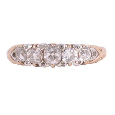 Lot 101 - A diamond five stone half hoop ring.