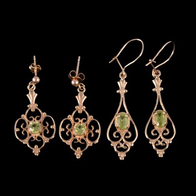 Lot 263 - Two pairs of peridot drop earrings.