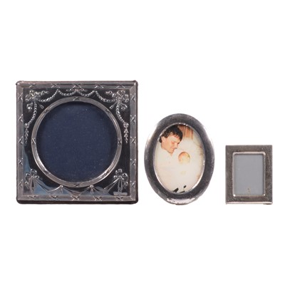 Lot 154 - Silver-mounted photograph frame, Keyford Frames Ltd, London 1990, and two small metal frames.