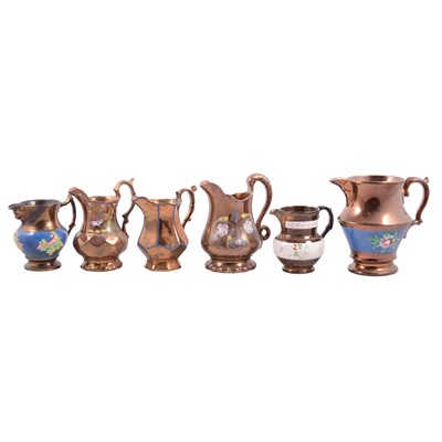 Lot 21 - Fifteen copper lustre jugs.