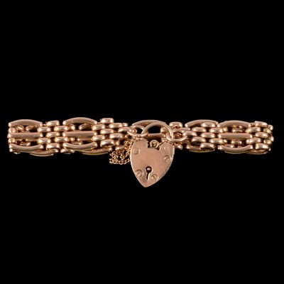 Lot 244 - A 9 carat rose gold three bar gate link bracelet.