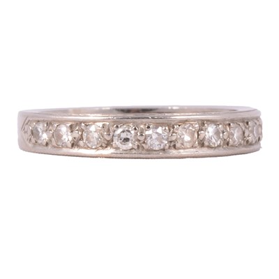 Lot 107 - A diamond half eternity ring.