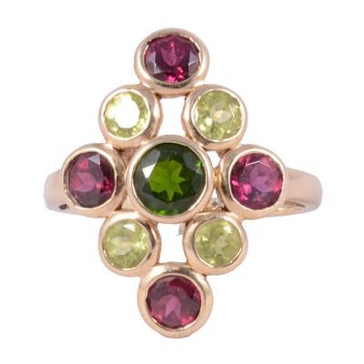 Lot 44 - A chrome diopside, peridot and garnet ring.