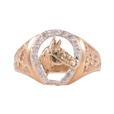 Lot 1113 - A diamond set horseshoe and horse head ring.