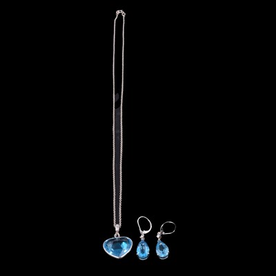 Lot 294 - A heat-treated blue topaz pendant on a chain, and a pair of earrings.