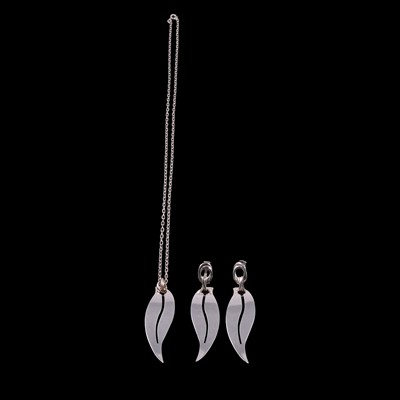 Lot 338 - An Italian white metal leaf design pendant on a chain and matching pair of earrings.