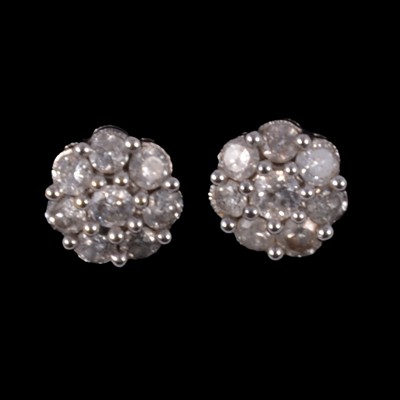 Lot 253 - A pair of diamond cluster earrings.