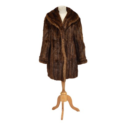 Lot 1231 - A short dark brown fur coat.