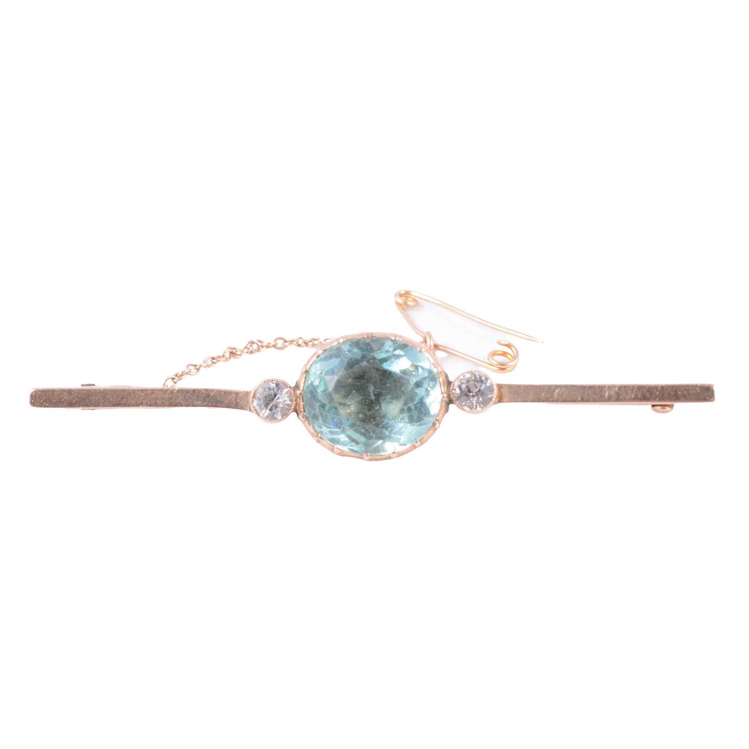 Lot 185 - A pale blue and white stone (not diamond) bar brooch.