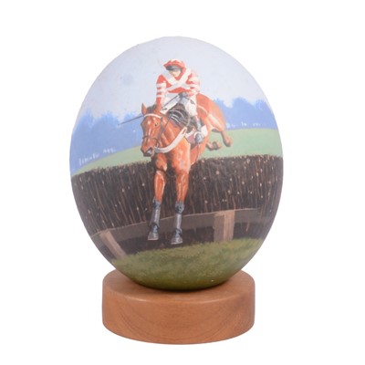 Lot 94 - Philip Toon, a hand painted ostrich egg, jockey over brush fence.