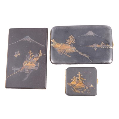 Lot 160 - Two Japanese Komai damascene cigarette cases, and a similar match case