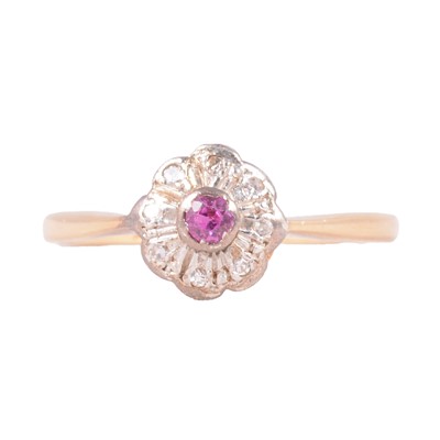 Lot 15 - A purplish-pink stone and diamond cluster ring.