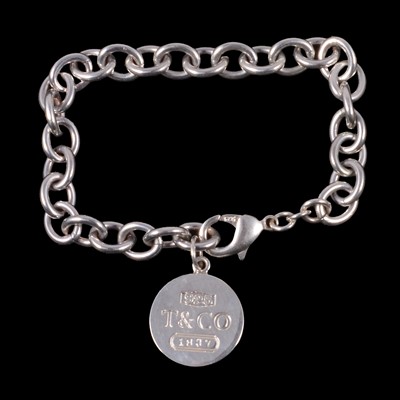 Lot 413 - Tiffany & Co - a white metal bracelet with circular tag marked T & Co, 1837.