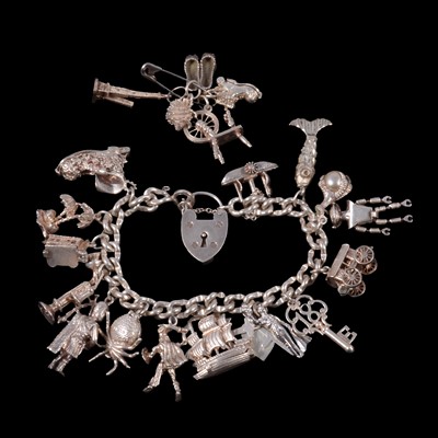 Lot 420 - A silver charm bracelet, and some loose charms.