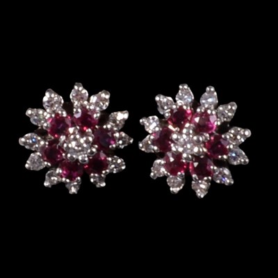 Lot 259 - A pair of ruby and diamond earrings.