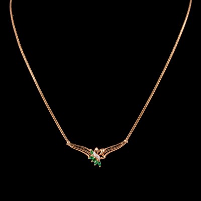 Lot 292 - A modern emerald and diamond necklace.