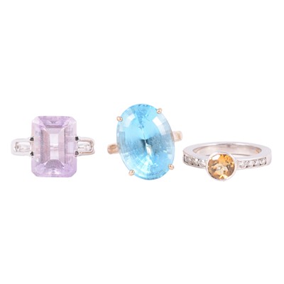 Lot 55 - Three gemset dress rings, heat treated blue topaz, citrine and diamond, amethyst.