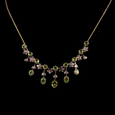 Lot 295 - A peridot and diamond fringe necklace.