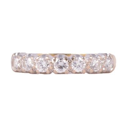 Lot 106 - A diamond half eternity ring.