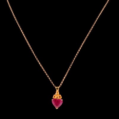 Lot 293 - A ruby and yellow sapphire pendant on a chain.