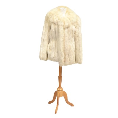 Lot 1226 - A light cream fur jacket.