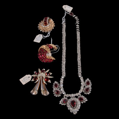 Lot 1198 - A vintage paste and faux ruby necklace, two fur clips and a brooch.