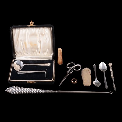 Lot 186 - A large silver handled button hook, cased spoon and pusher set, cigar holder, scissors, teaspoons.