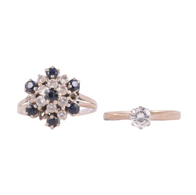 Lot 86 - A diamond solitaire ring, and a sapphire and diamond cluster ring.