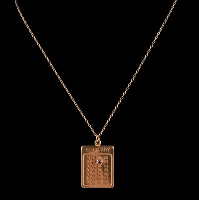 Lot 325 - A 9 carat yellow gold calendar pendant and chain, another gold chain.