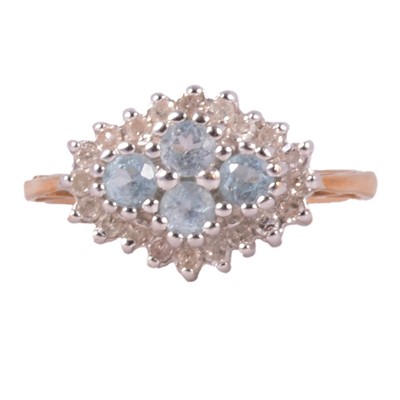 Lot 39 - A pale blue gemstone and diamond cluster ring.