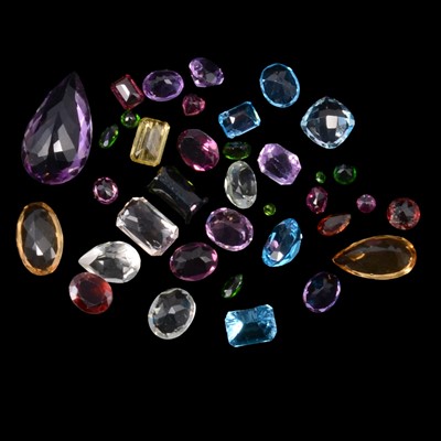 Lot 400 - Thirty-six loose coloured gemstones.