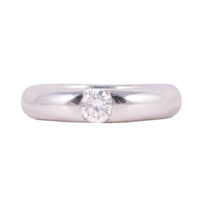 Lot 69 - Cartier - a diamond solitaire ring.