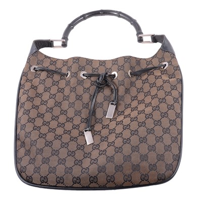 Lot 1241 - Gucci - a GG print bamboo handle fabric bag.