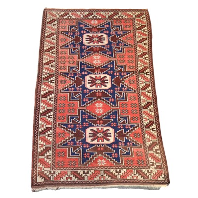 Lot 416 - Caucasian rug with three medallions