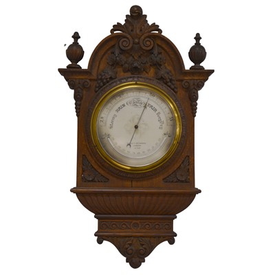 Lot 384 - Negretti and Zanbra of London, an oak cased aneroid barometer/thermometer.