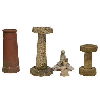 Lot 437 - Garden ornaments: two birdbaths, two pixie figures, and a terracotta chimney