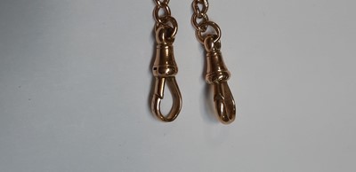 Lot 1099 - A 9 carat rose gold double Albert watch chain with fob.
