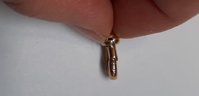Lot 1099 - A 9 carat rose gold double Albert watch chain with fob.