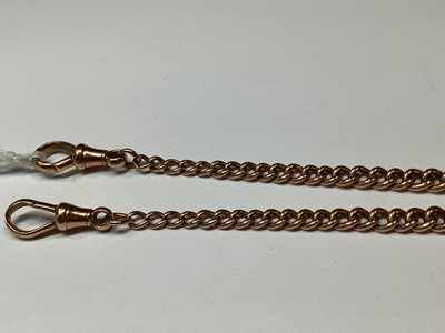 Lot 1099 - A 9 carat rose gold double Albert watch chain with fob.