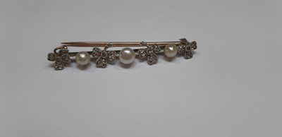 Lot 280 - A pearl and diamond necklace and similar bar brooch.
