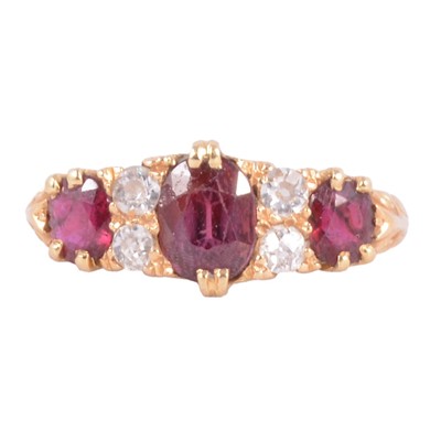 Lot 9A - A ruby and diamond half hoop ring.