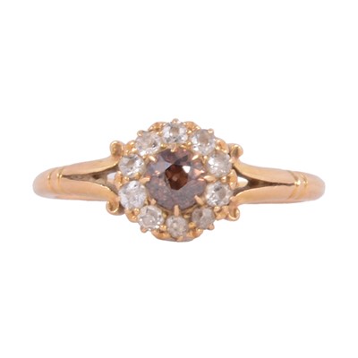 Lot 117A - A brown diamond and white diamond cluster ring.