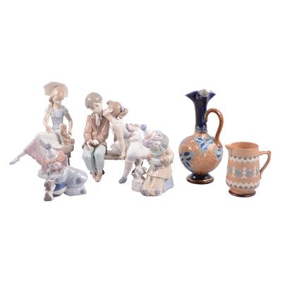 Lot 7 - Four Lladro figures and two Doulton stoneware vases.