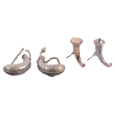 Lot 150 - Two Norwegian sterling pepperettes, horn form, and two white metal small powder flasks