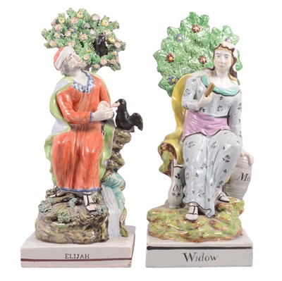 Lot 16 - Matched pair of Staffordshire earthenware figures, Widow of Zarephath and Elijah