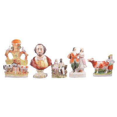 Lot 37 - A collection of Staffordshire figures