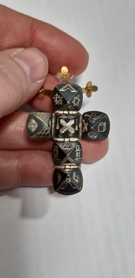 Lot 280 - Two transforming Masonic folding orb ball pendants, and a yellow metal St Christopher pendant.