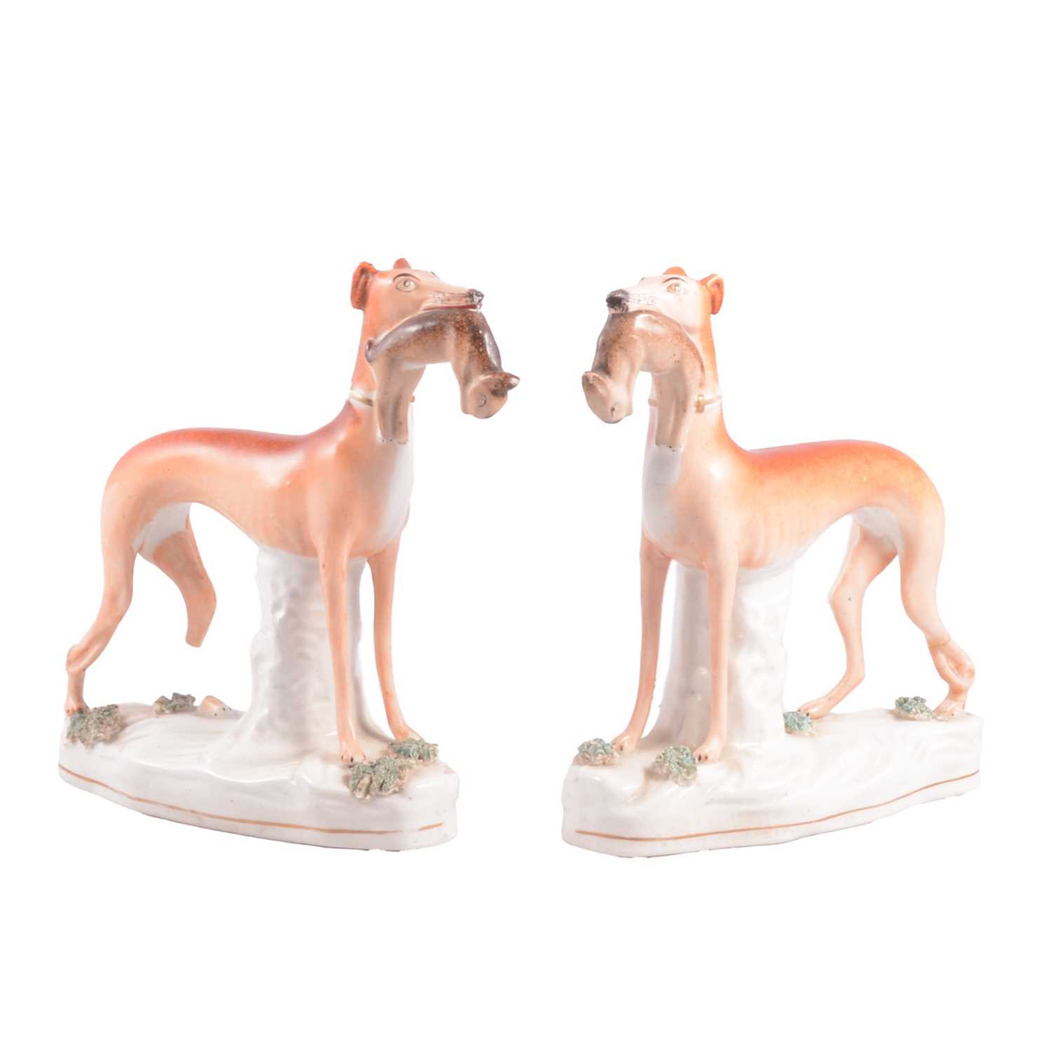 Lot 42 - Pair of Victorian Staffordshire pottery models, greyhounds